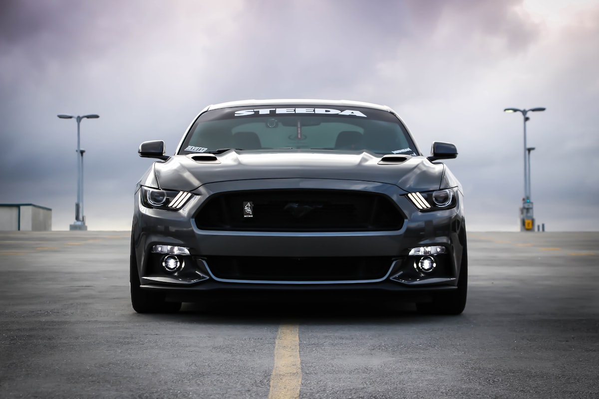 Dark grey car photographed head-on