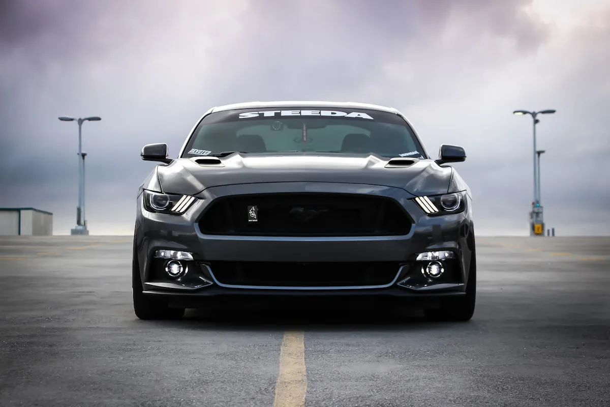Dark grey car photographed head-on